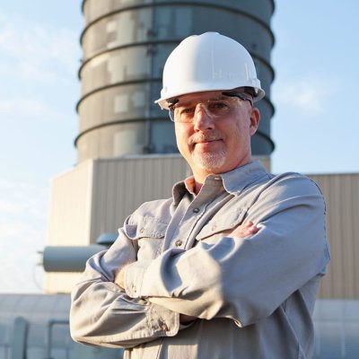 Lead battery recycling facility employee dedicated to environmental health and safety.