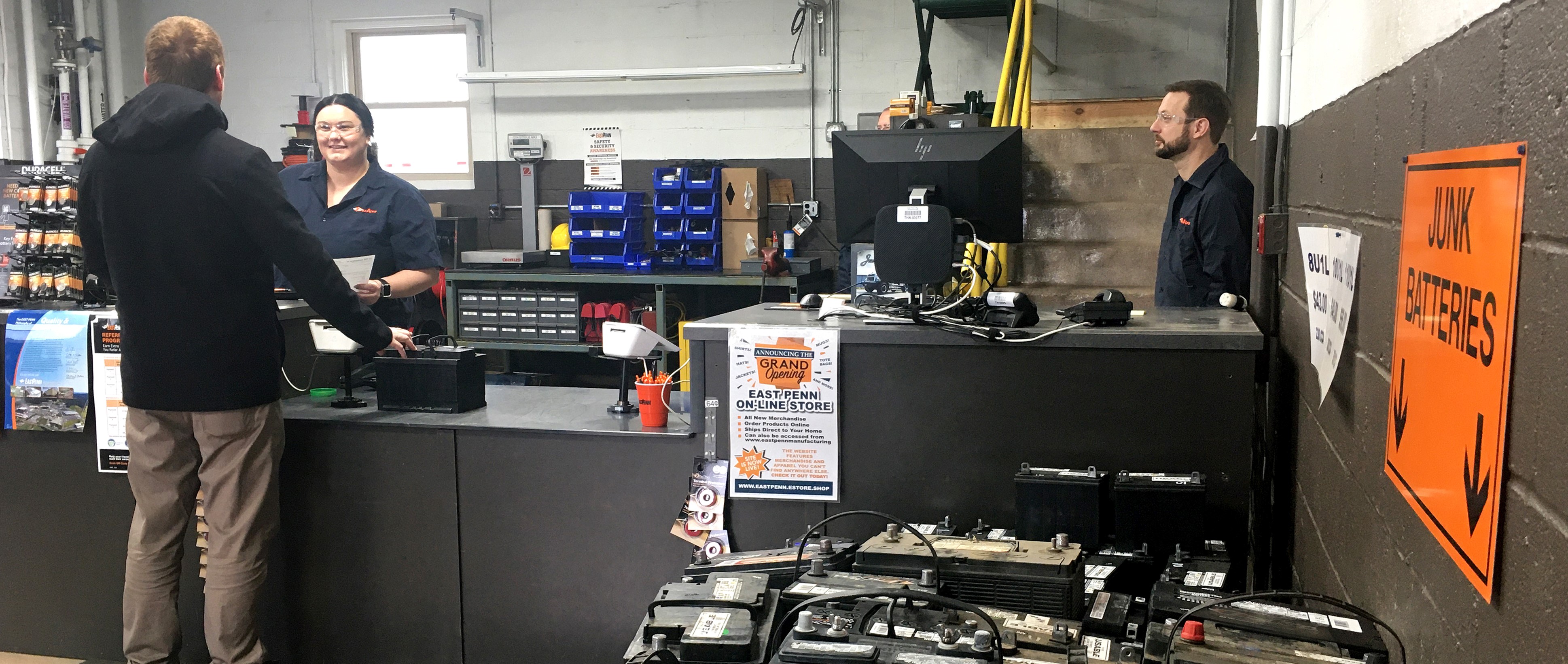 Customer brining in an old lead battery to recycle at the factory store