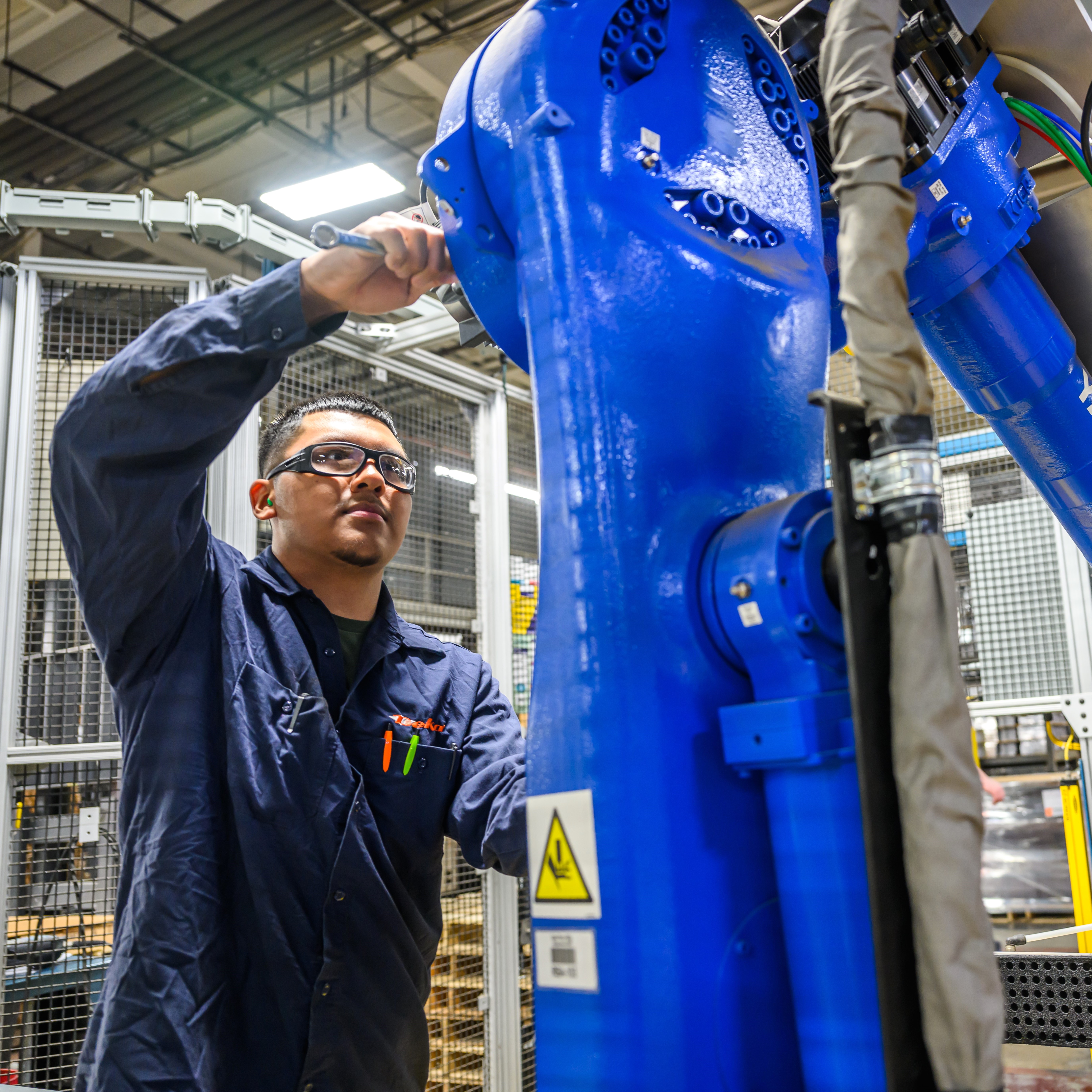 Maintenance employee at a lead battery recycling facility.