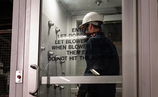 Body vacuum chamber to collect lead dust for worker health and safety.